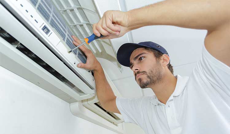 HVAC technician installs a new mini-split system